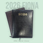 Black 2026 dated diary on a light green background